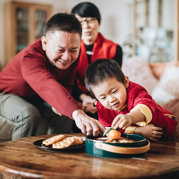 two people working together on a computer